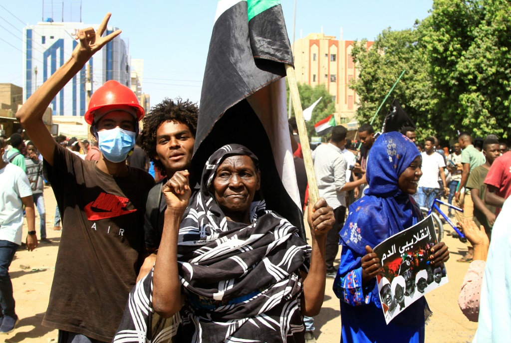 Pro-democracy protesters in Sudan's capital Khartoum on Tuesday march to mark the first anniversary of a military coup