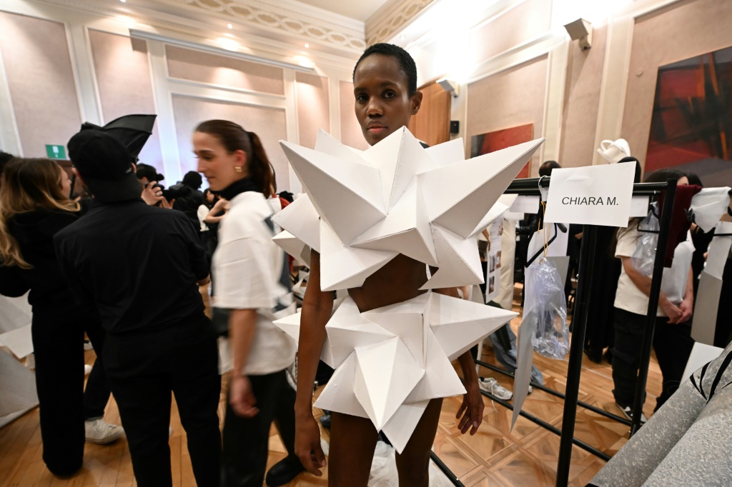 A model backstage prior to the presentation of Atsushi Nakashima's Fall-Winter 2023-2024 Women's collection on Sunday