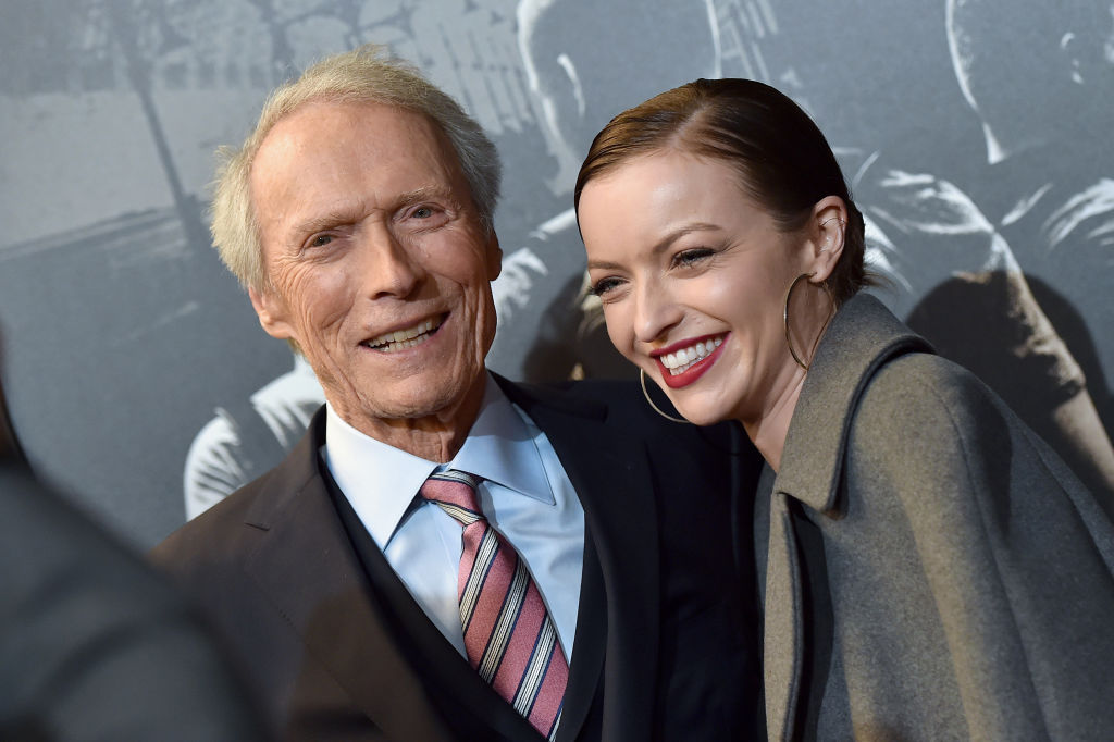 Clint Eastwood and daughter Francesca Eastwood at Warner Bros. Studios smiling for a photo