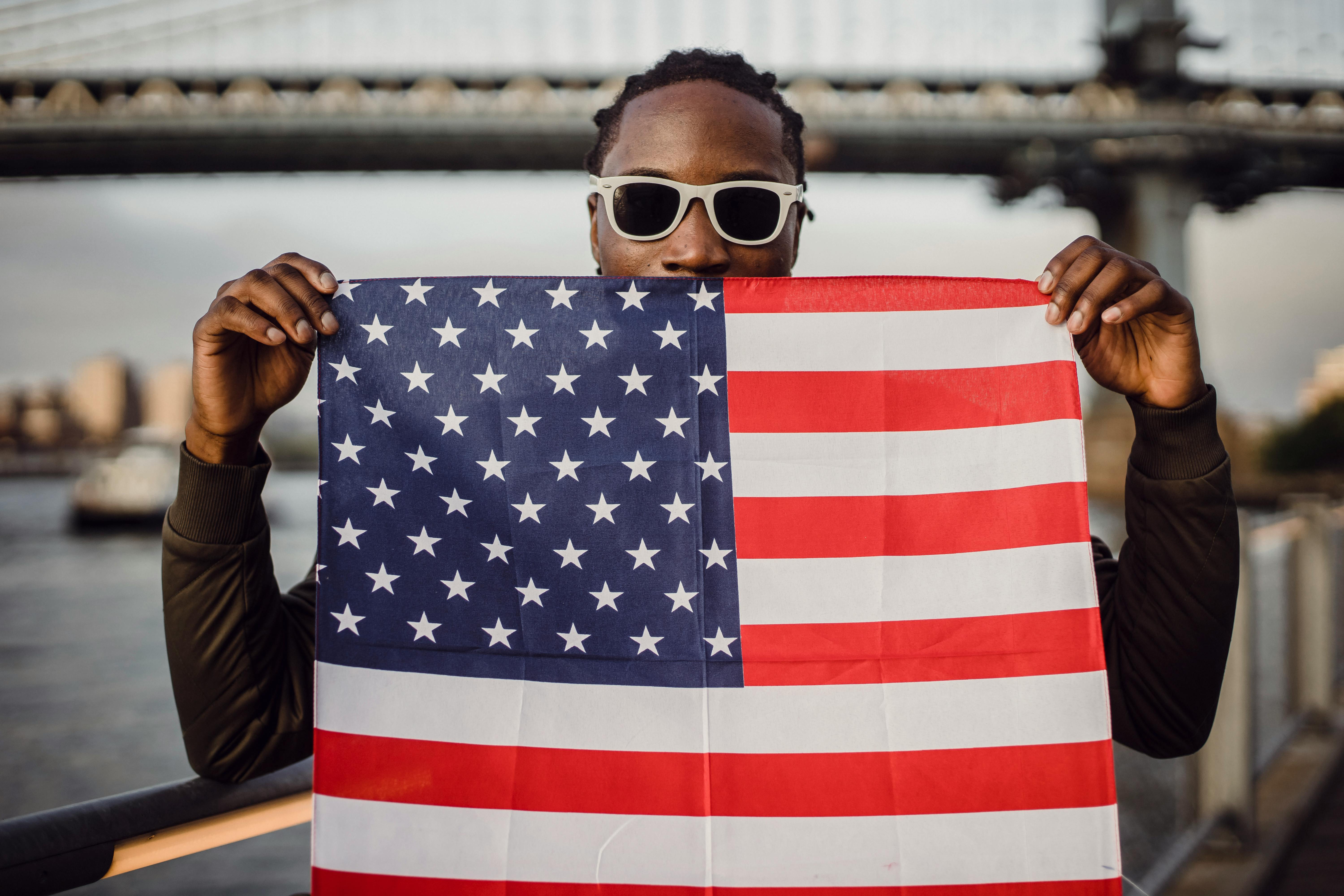 An African-American man with an American flag kerchief in his hands