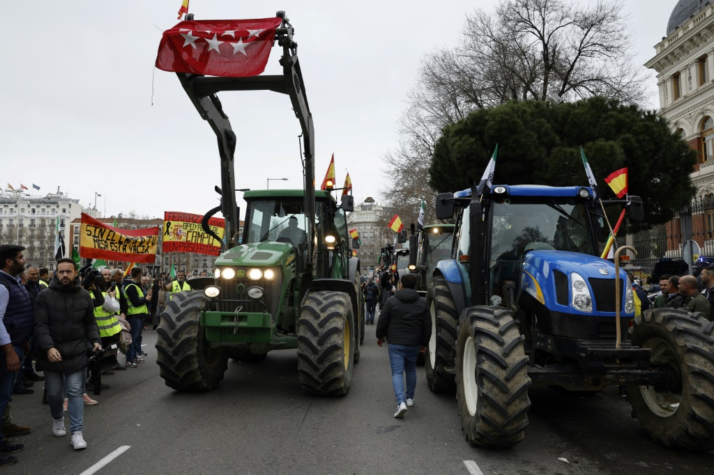 Tractors block off a street in front of Spain's agriculture ministry in central Madrid during a farmers protest on their conditions and European agricultural policy