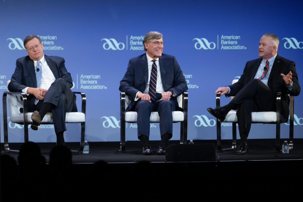 United Bank CEO Jim Edwards (L), Zions Bank President A. Scott Anderson (c) and Jonesburg State Bank CEO Dan Robb (R) speak during a panel of the American Banking Association summit in Washington