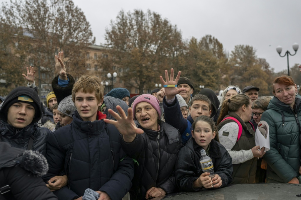 Kherson residents waiting for aid to be distributed following the withdrawal of Russian troops