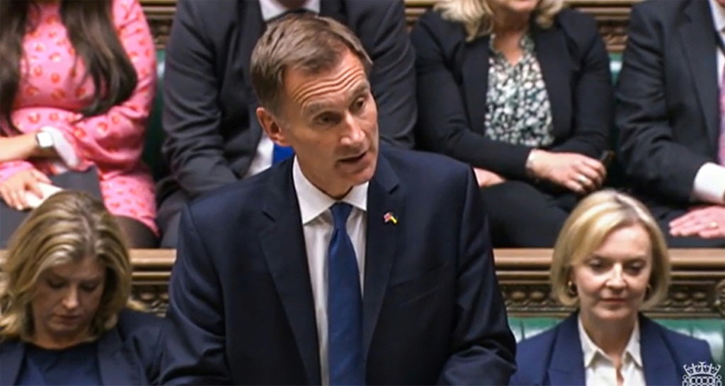 New finance minister Hunt told parliament Truss had agreed to reverse almost all the tax measures announced three weeks ago as the grim faced premier looked on