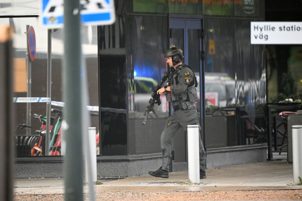 Police secure the area after a shooting wounded two people at Emporia Shopping Center in Malmo, Sweden, on August 19, 2022 -- rising gang shootings have been a dominant issue in the election campaign