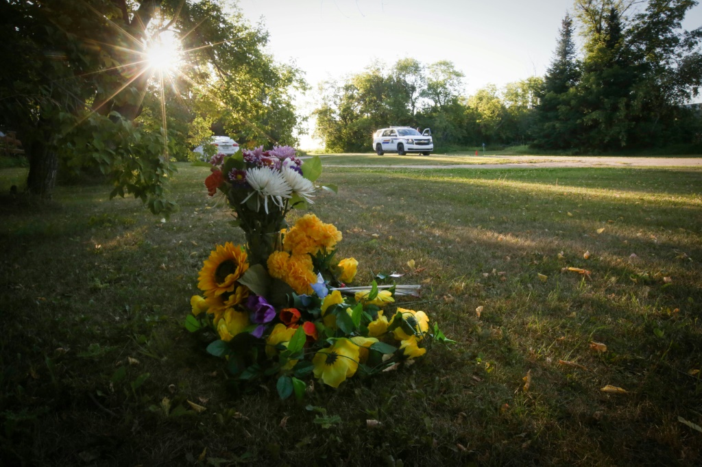 Flowers sit outside the house where one of the stabbing victims was found in Weldon, Saskatchewan, Canada