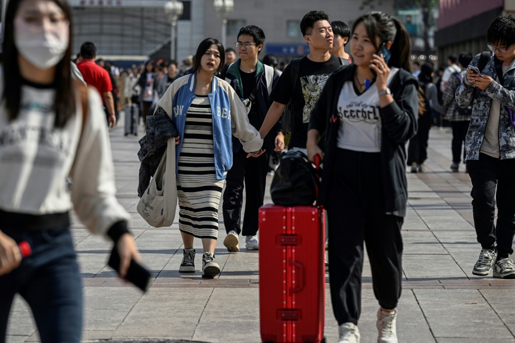 China's state media reported a significant boost in the number of travellers compared with the same period last year