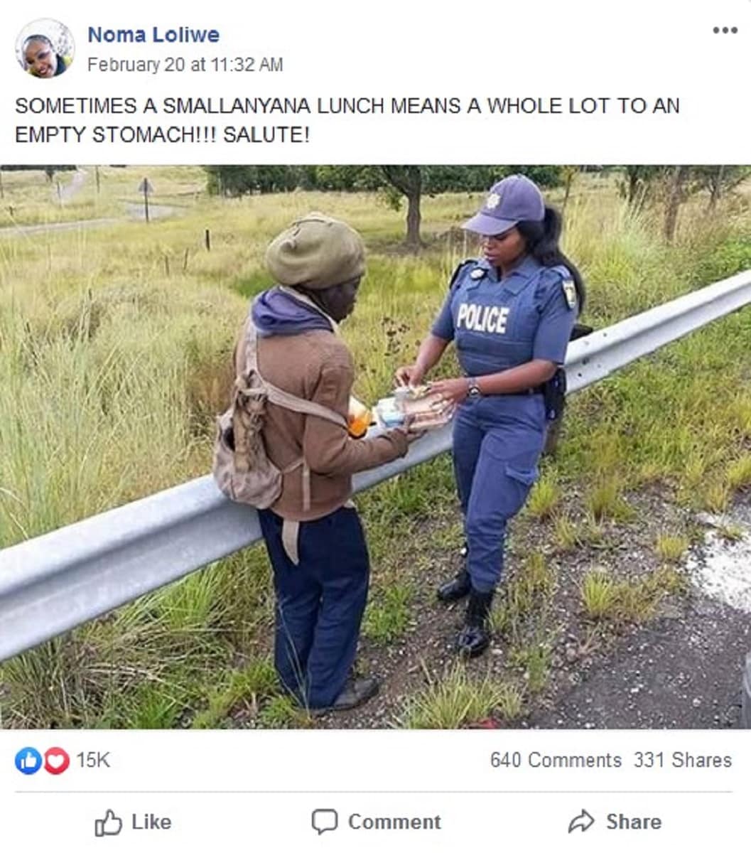 Heart-warming photo shows beautiful police officer giving madala food