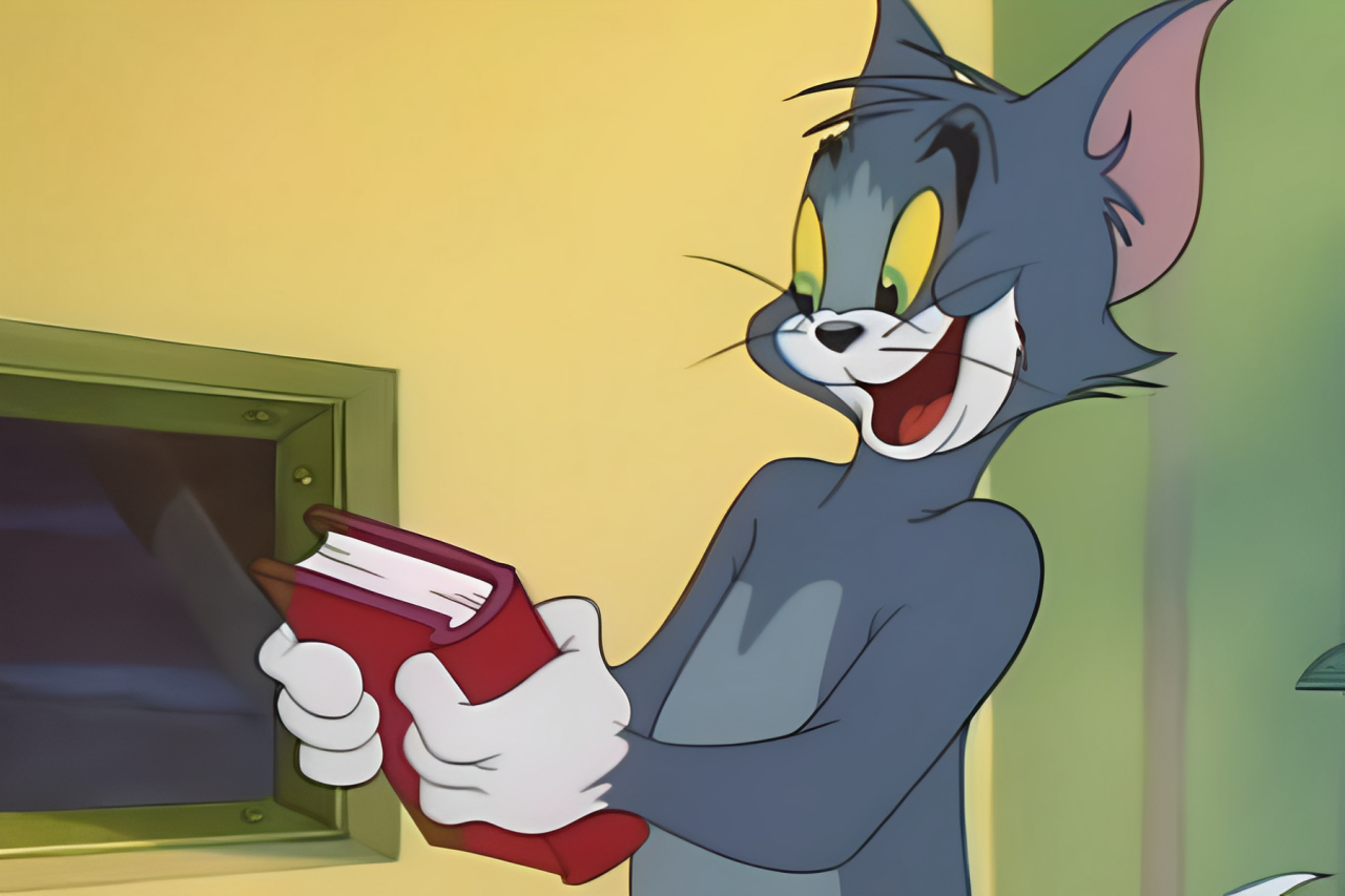 Jerry Mouse is holding a red book