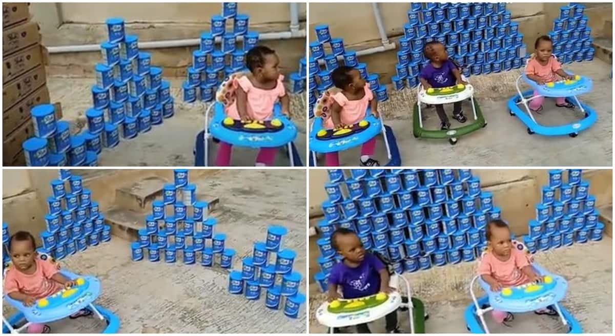 Photos of Nigerian triplets sitting close to plenty tins of Peak 123 they have finished.