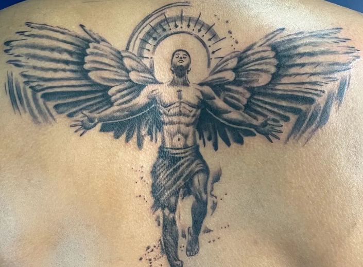 A guardian angel tattoo with open hands and wings