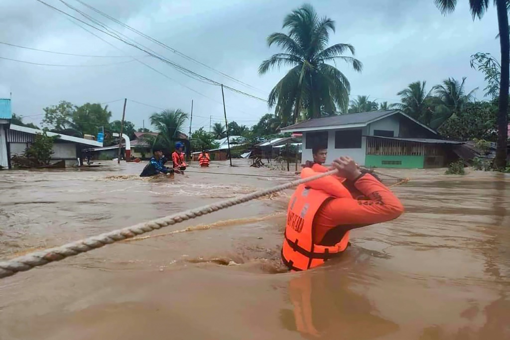 Tropical Storm Nalgae has unleashed flash floods and landslides in parts of the Philippines