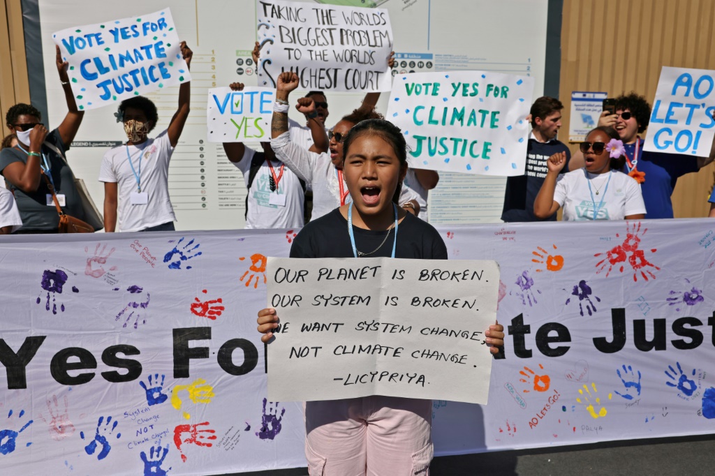 Members of the activist group Pacific Island Students Fighting Climate Change (PISFCC) stage a protest during the COP27 climate conference in the Egyptian restort town of Sharm el-Sheikh