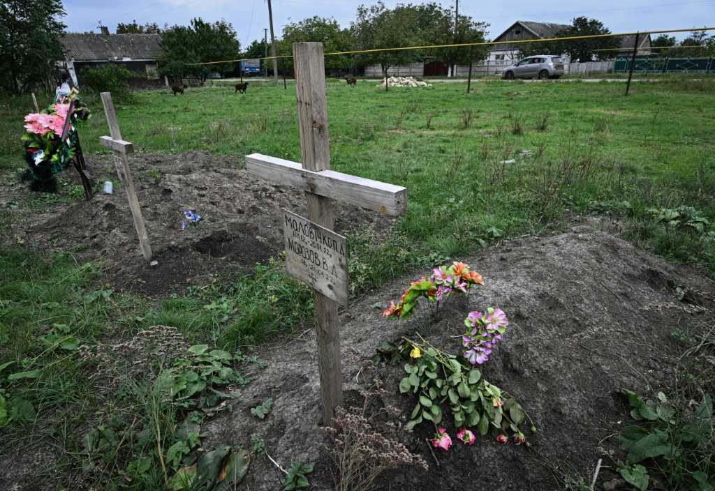 Five hastily dug graves have appeared in the village since the start of the invasion