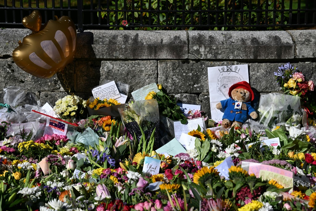 A nation mourns -- floral tributes and a toy Paddington bear outside Balmoral Castle, the Scottish retreat where Queen Elizabeth II died
