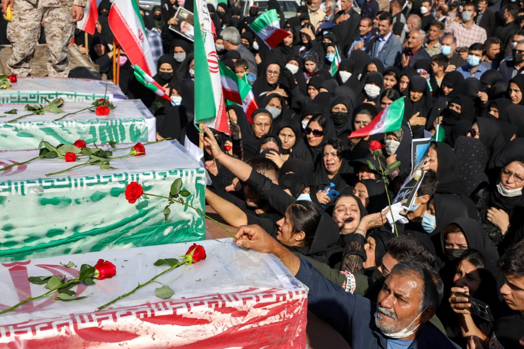 Iranians take part in a funeral in Izeh, a city in the country's southwest
