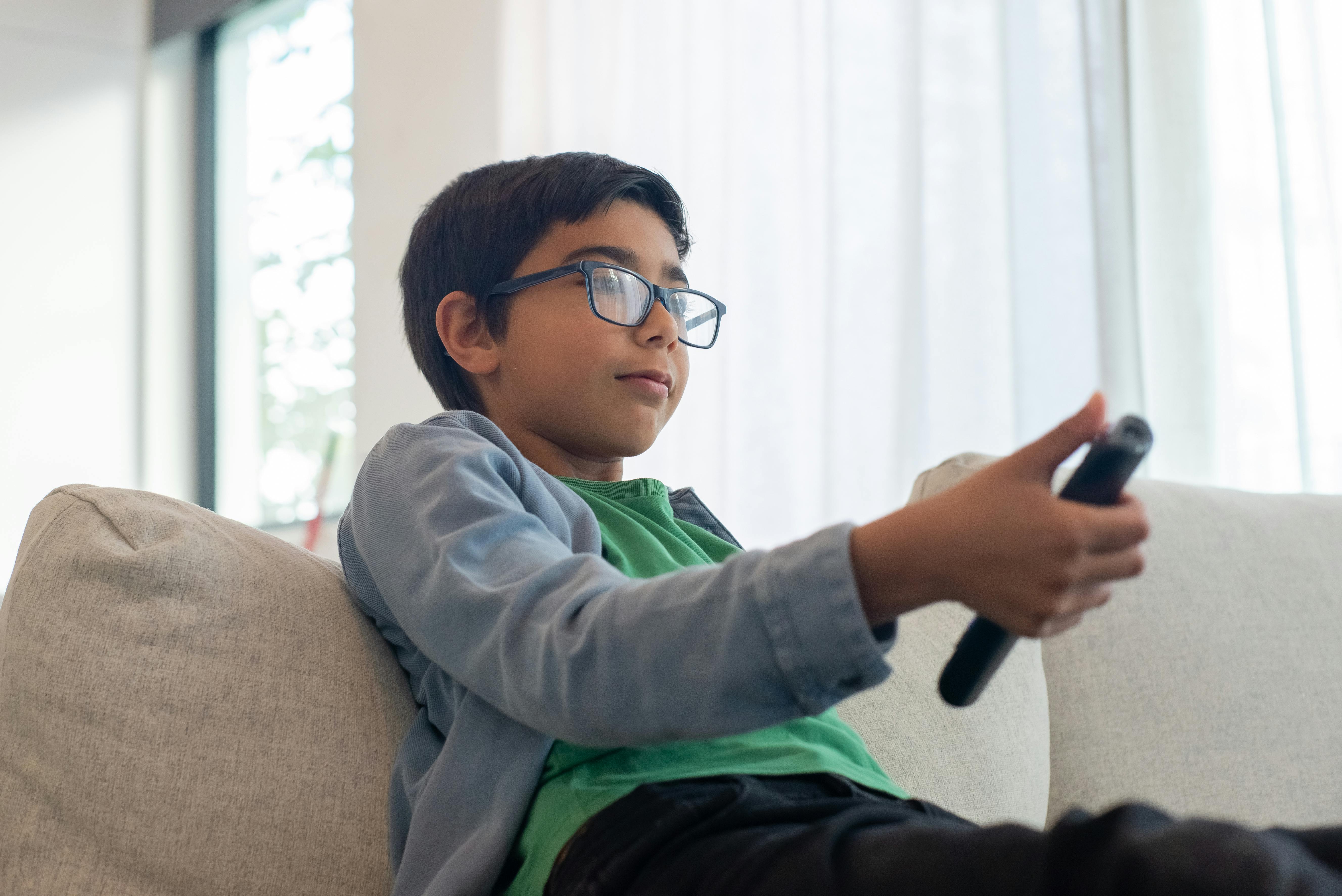 A boy holding a remote control