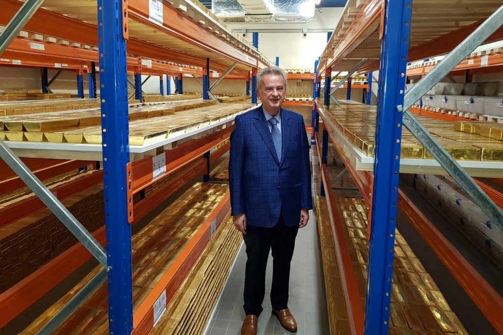 Lebanon's central bank governor Riad Salameh stands next to stacks of gold bars in the bank vaults in the Lebanese capital Beirut on November 24, 2022