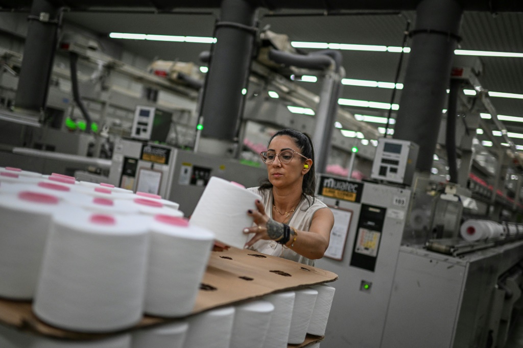 A Riopele employee piles thread rolls at the state-of-the-art factory in Vila Nova de Famalicao