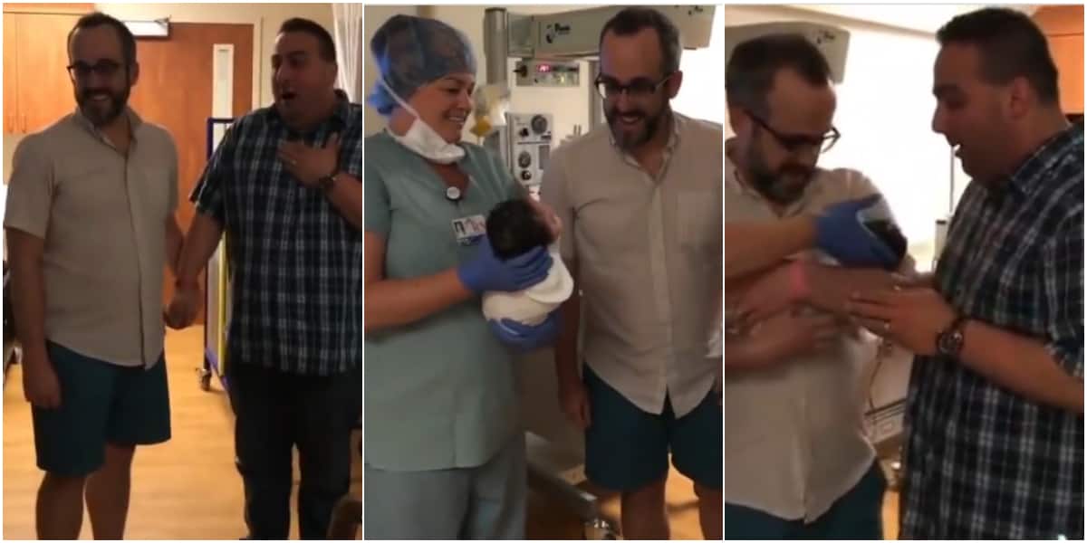 A father was excited as he carried his baby for the first time