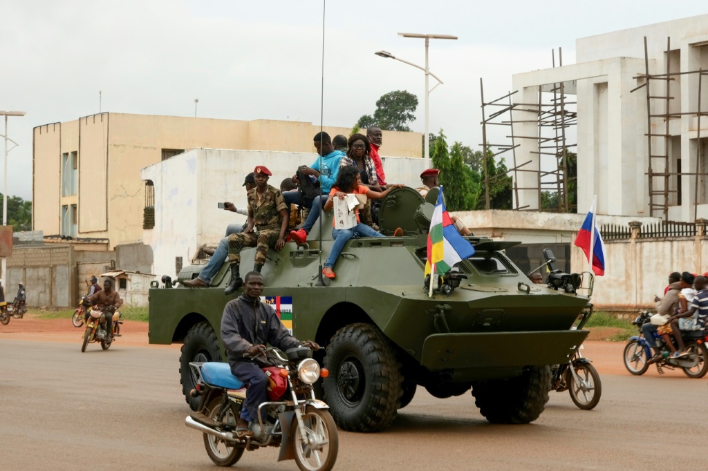 A Russian armoured personnel carrier, decorated with Russian and CAR flags, in the streets of Bangui in October 2020