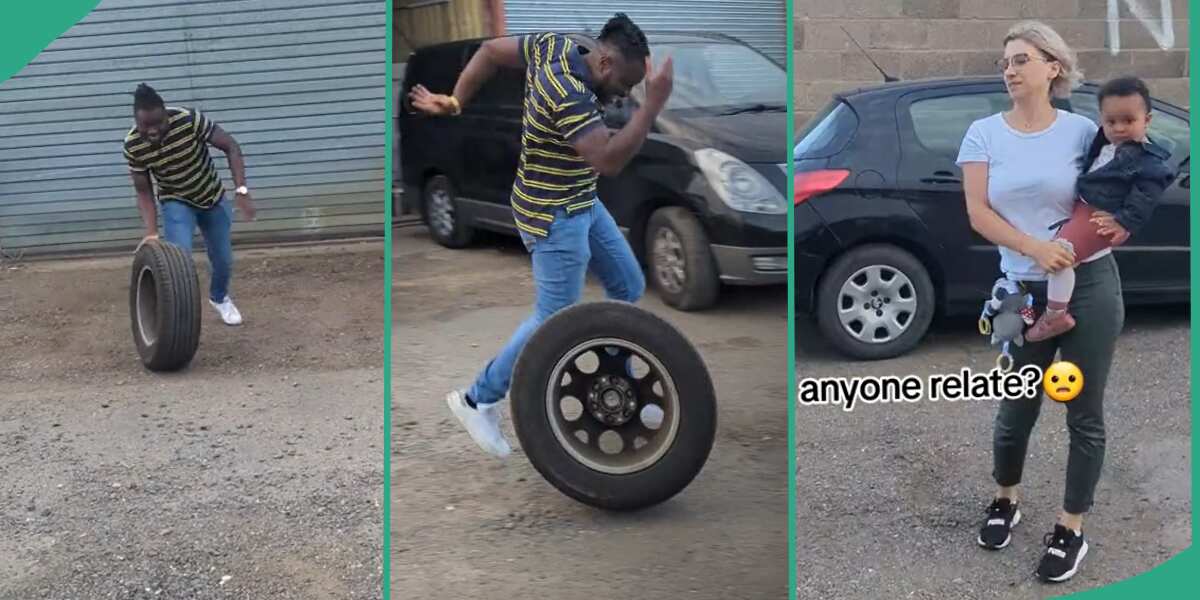 Man playing with car tyre.