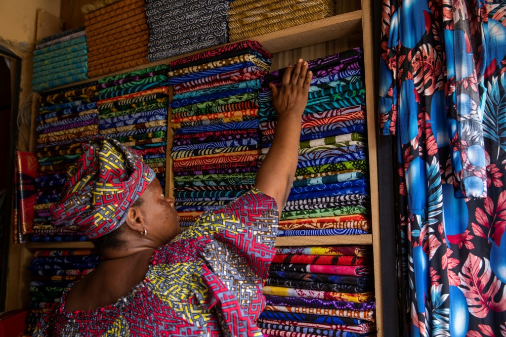 Trader Christiana Morenikeji Ilesanmi, 56, says she is selling a lot of Chinese-made adire fabrics because they are cheaper