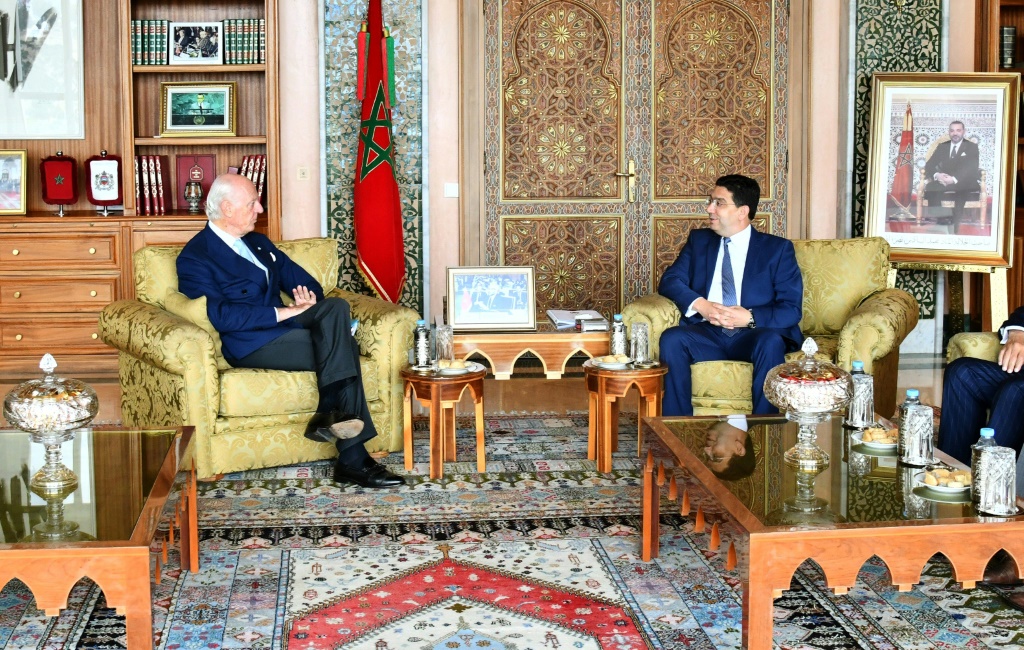 A handout released by the Moroccan foreign ministry shows Morocco's Foreign Minister Nasser Bourita (R) receiving the UN secretary general's personal envoy for Western Sahara, Staffan de Mistura (L) in the capital Rabat