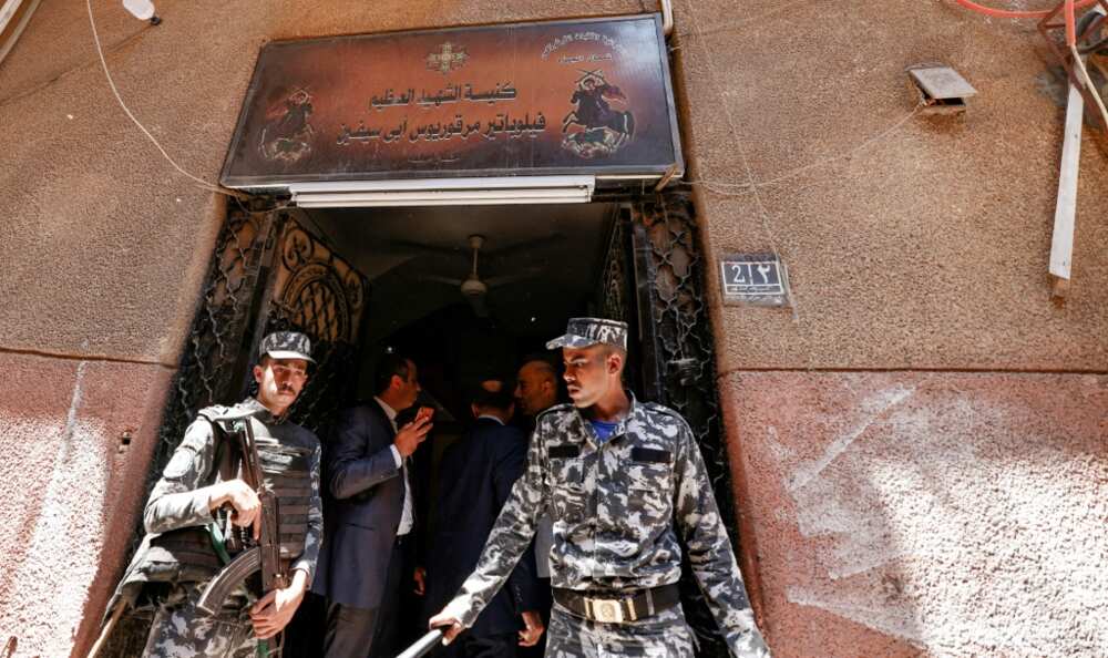 Egyptian police outside the charred Abu Sifin church located in the densely populated Imbaba neighbourhood west of the Nile river on August 14, 2022