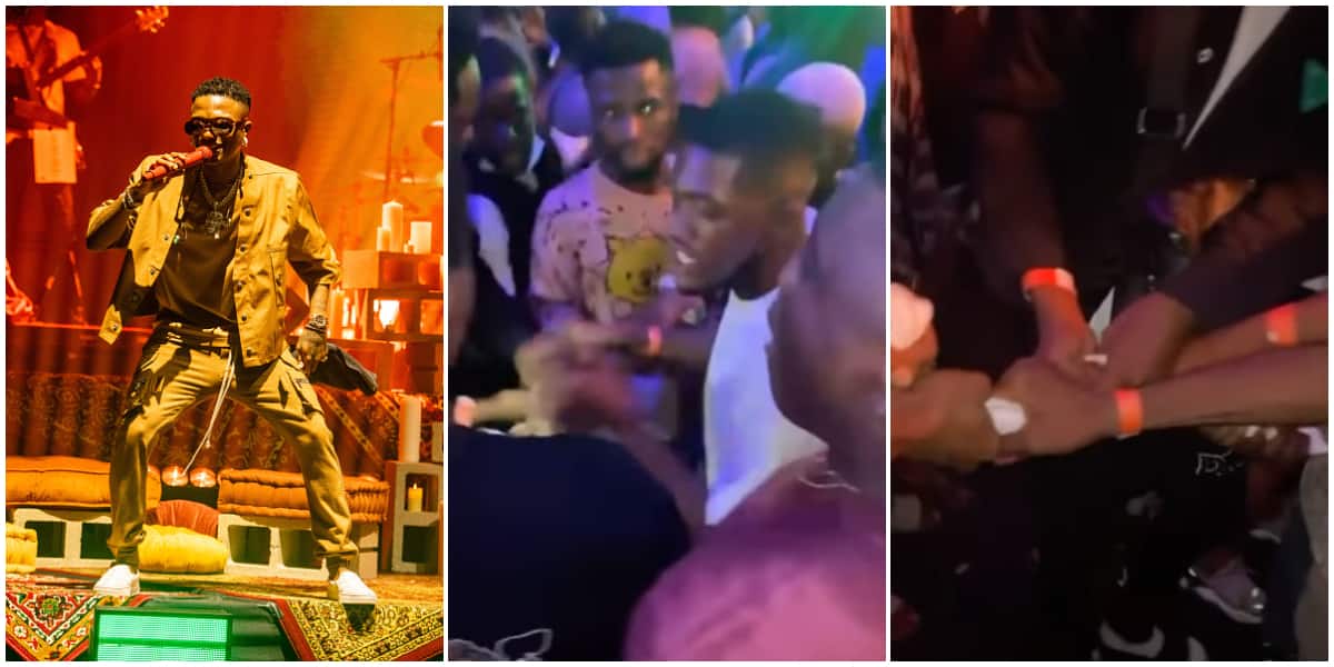 Men burn and share Wizkid's sweaty towel after catching it during his performance in Warri, video stirs reactions