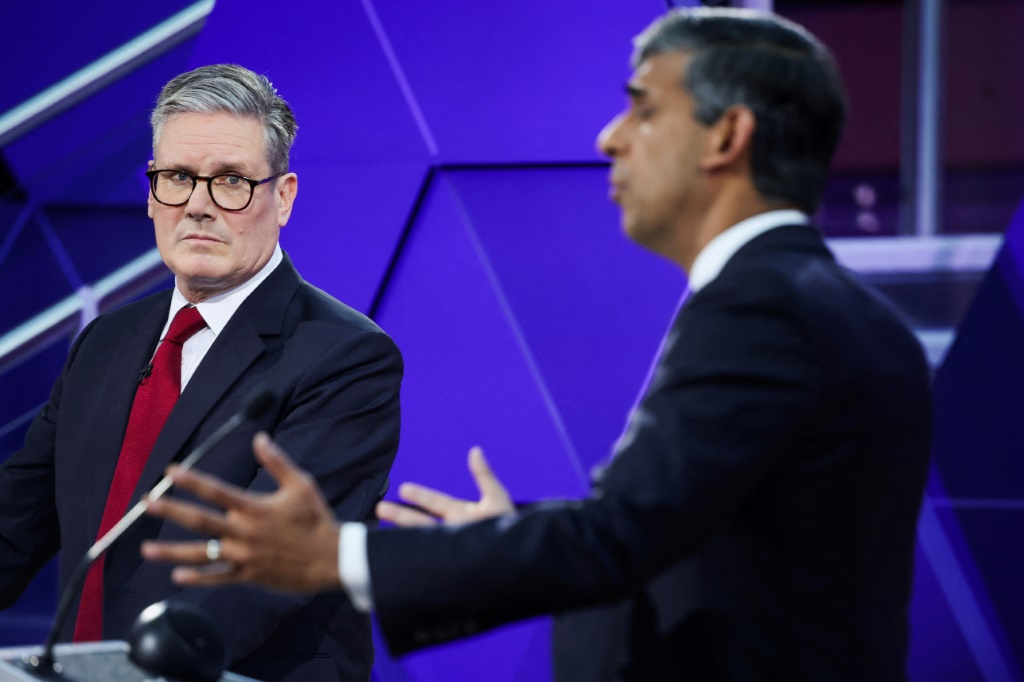 Traders will be following the UK general election Thursday, in which the Labour Party of Keir Starmer (L) is expected to win a landslide against Prime Minister Rishi Sunak (R) and his Conservative Party