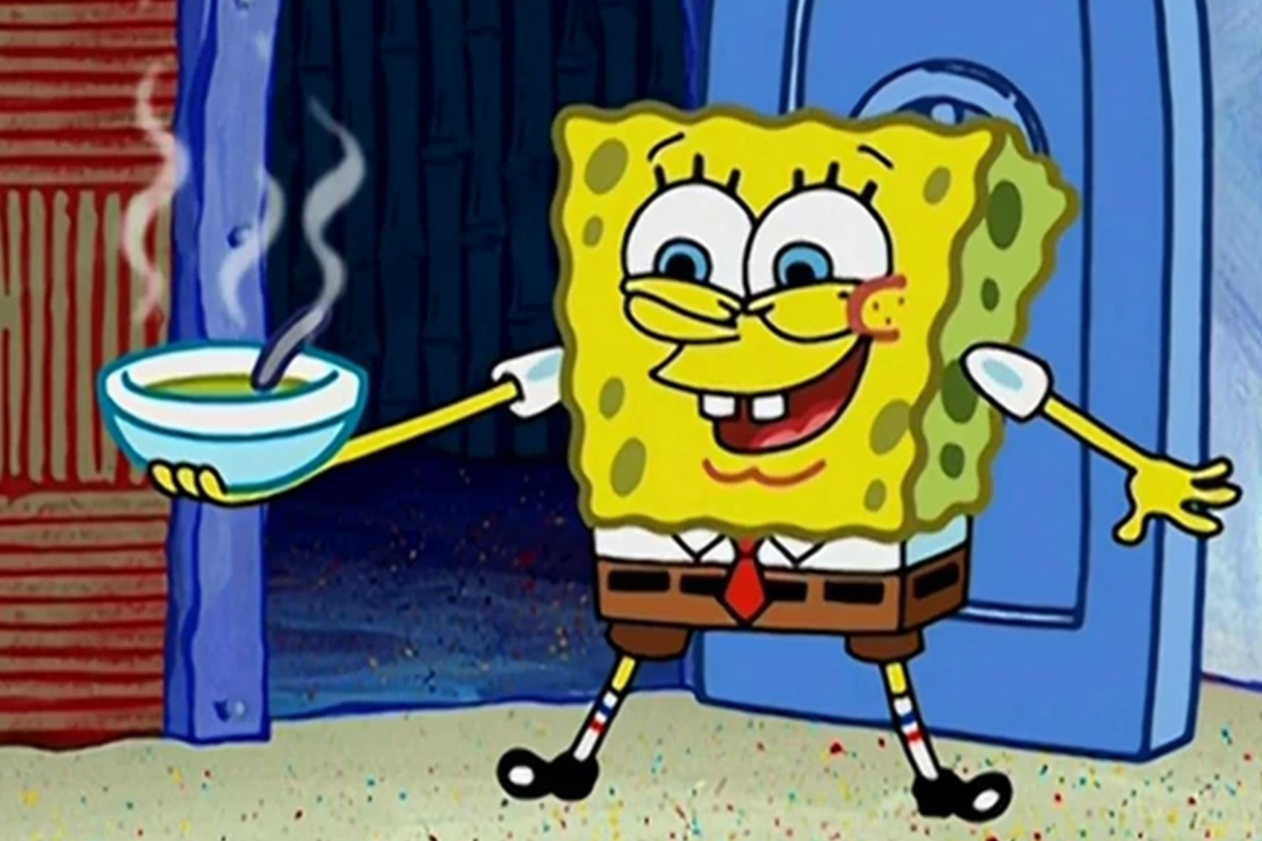 SpongeBob SquarePants is holding a bowl with hot soup.