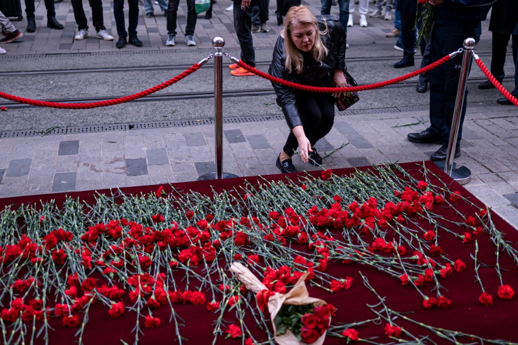 Residents came to lay red carnations at the site of the explosion