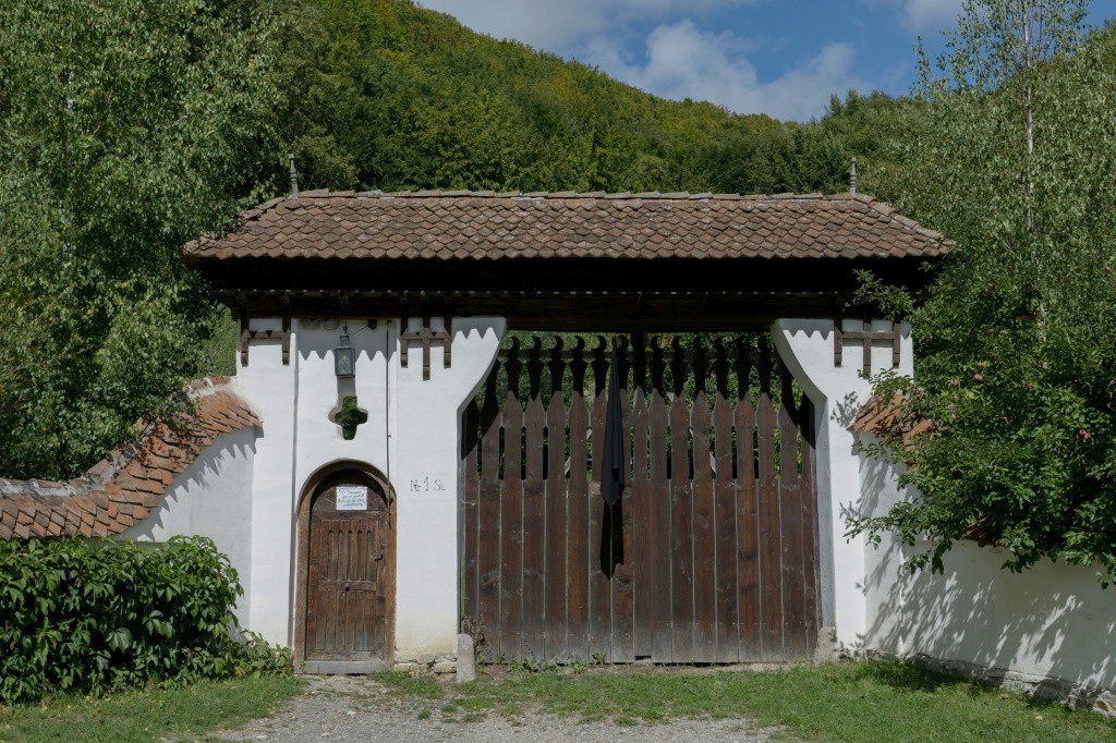 A black veil hangs at the entrance to the cottage owned by Charles in the village of Valea Zalanului