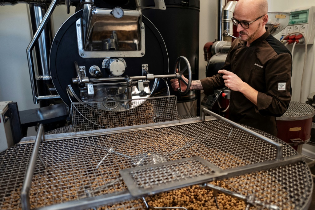 Guido Castagna toasts hazelnuts in his laboratory