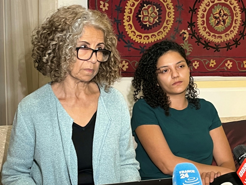 Ahdaf Soueif, aunt of Alaa Abdel Fattah, and his sister Sanaa Seif, speak to reporters after visiting him in prison on Thursday