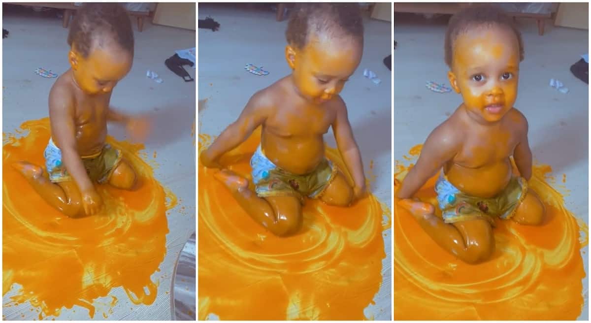 Black baby boy sitting playfully on spilled palm oil that costs 10$ or about N4,000.