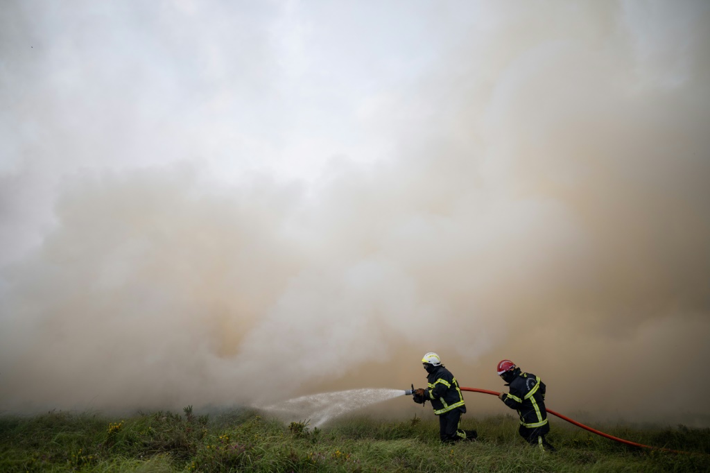 Cooler air swept into western Europe helping to bring fires under control