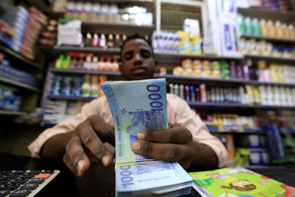 Sudanese shop owners complain their sales have plummeted over the past six months as inflation has sapped the purchasing power of their customers