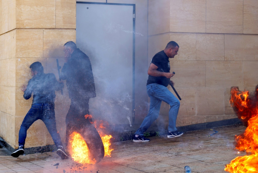 Lebanese protesters clash with bank guards in Beirut during a demonstration on May 9, 2023