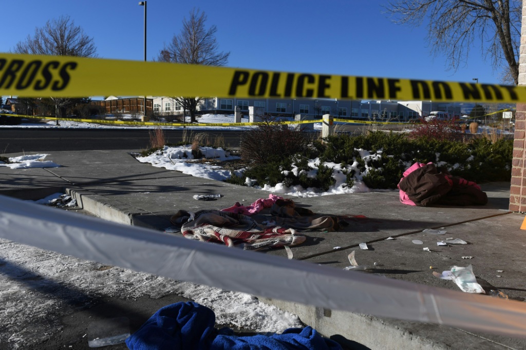 Blood-stained clothing is seen on the ground near Club Q, the Colorado Springs nightclub where a mass shooting killed at least five people