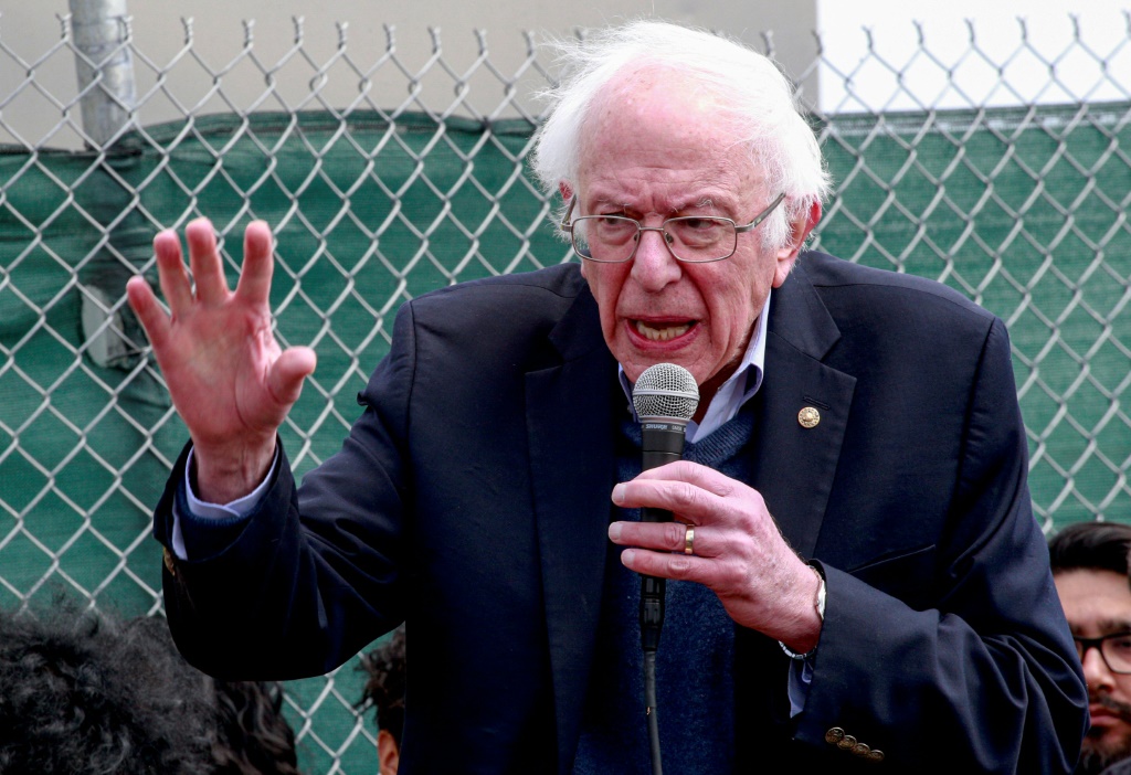In this file photo taken on April 24, 2022, US Senator Bernie Sanders speaks with Amazon workers during a rally outside the company building in Staten Island, New York