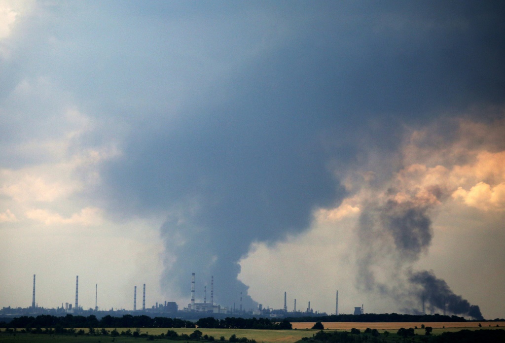 A huge cloud of smoke rose into the sky from the vicinity of a disused oil refinery near Lysychansk