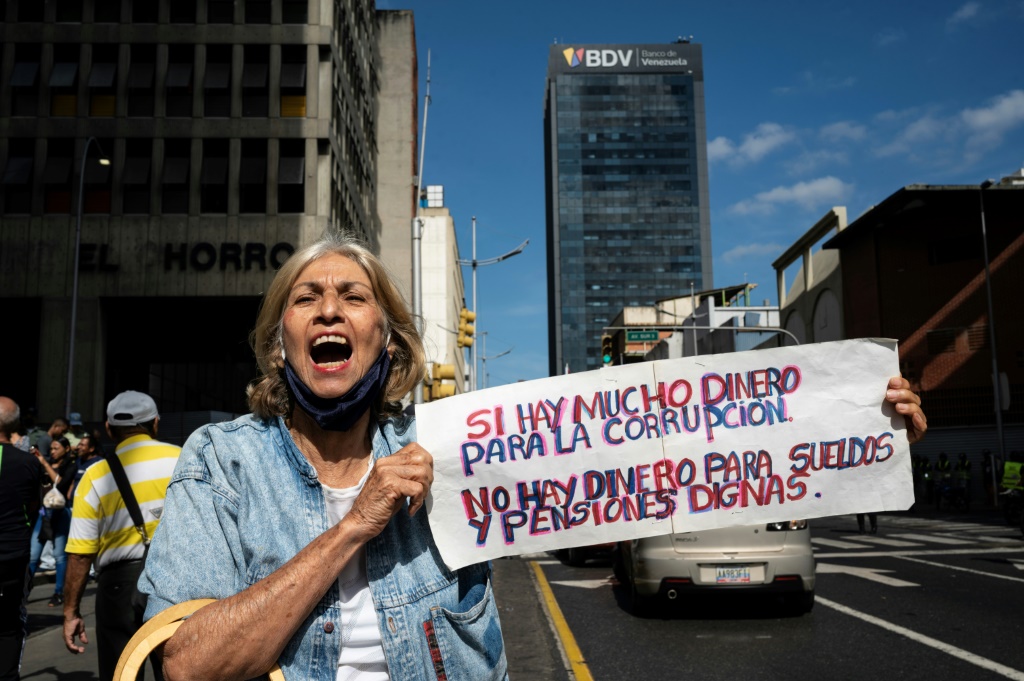 A woman shouts anti-corruption slogans during at a protest in Caracas on March 27, 2023