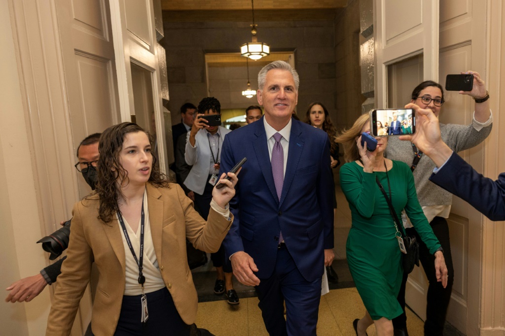 US Speaker of the House Kevin McCarthy is followed by members of the media in the Capitol on April 26, 2023