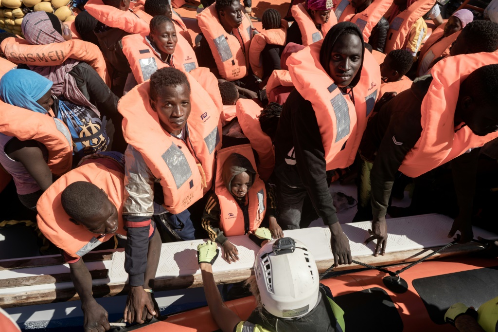 Migrants prepare to board the Ocean Viking plying international waters off Libya after their rescued