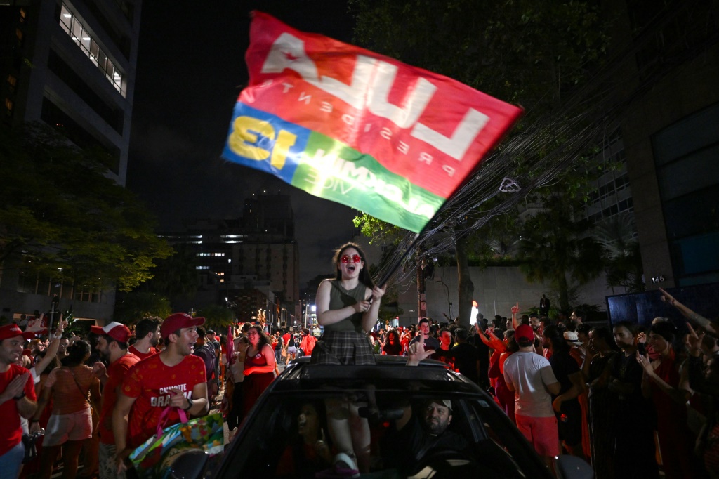 Supporters of President-elect Luiz Inacio Lula da Silva celebrate after their candidate narrowly won a runoff election against far-right incumbent Jair Bolsonaro