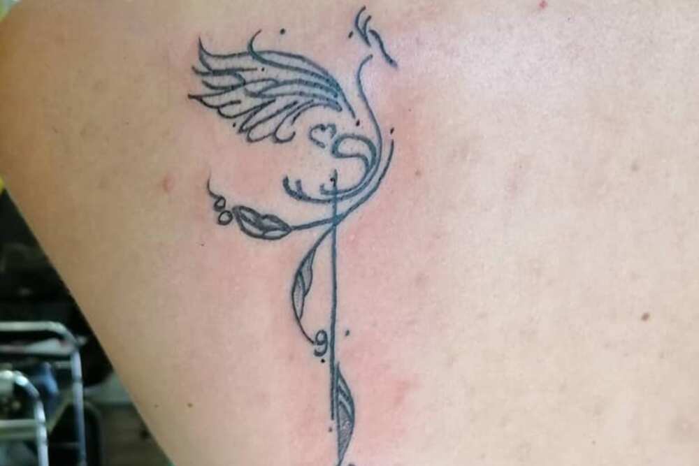feminine rebirth phoenix tattoo