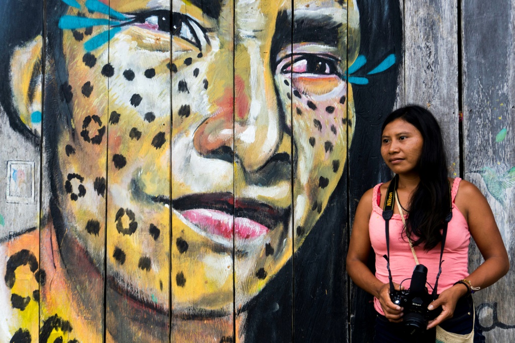 A Matis indigenous filmmaker poses for a picture in San Martin de Amacayacu, Colombia, on October 14, 2022