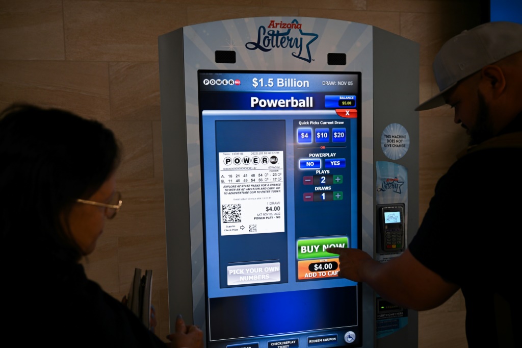 People purchase lottery tickets on November 3, 2022 in the Phoenix, Arizona airport, when the Powerball jackpot was only $1.5 billon